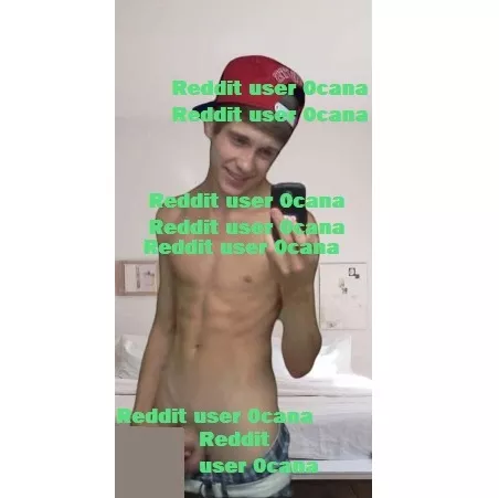 18, American. Wearing red hat, blue checkered boxers, and white belt.