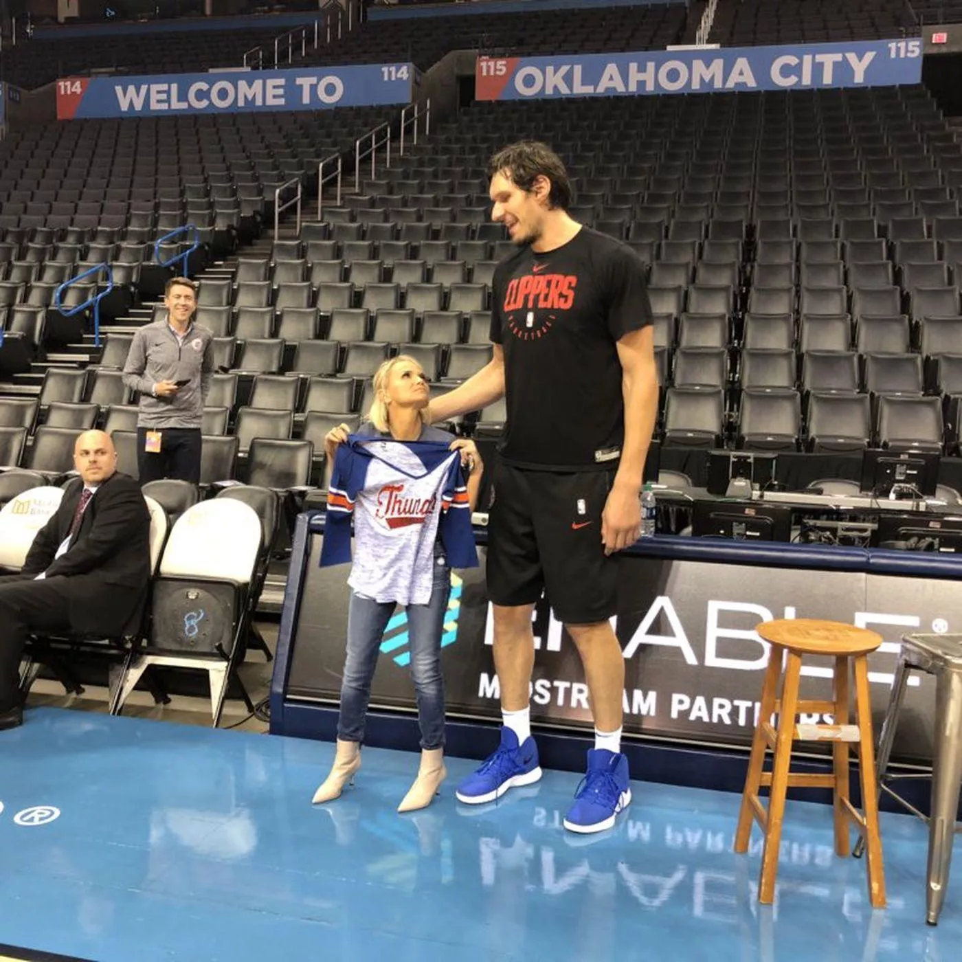 4’11 Kristen Chenoweth with 7’3 Clippers player Bogdan Marjanovic