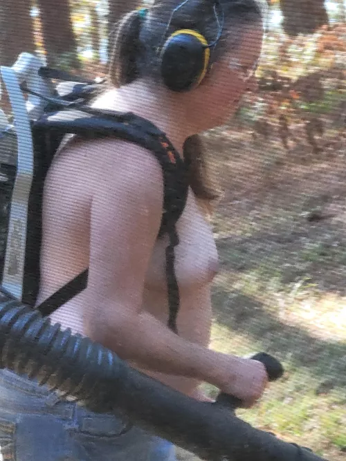 60 yo gilf leaf blowing by the lake.