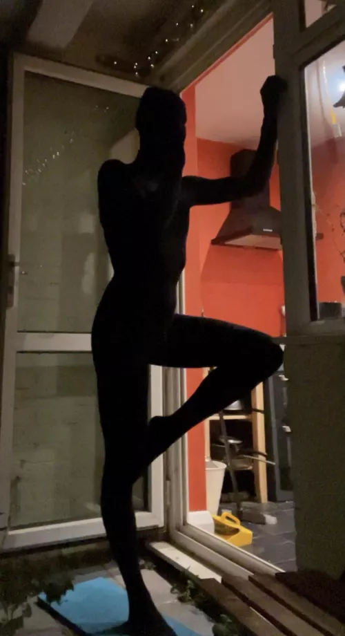 A shadow on the balcony at night