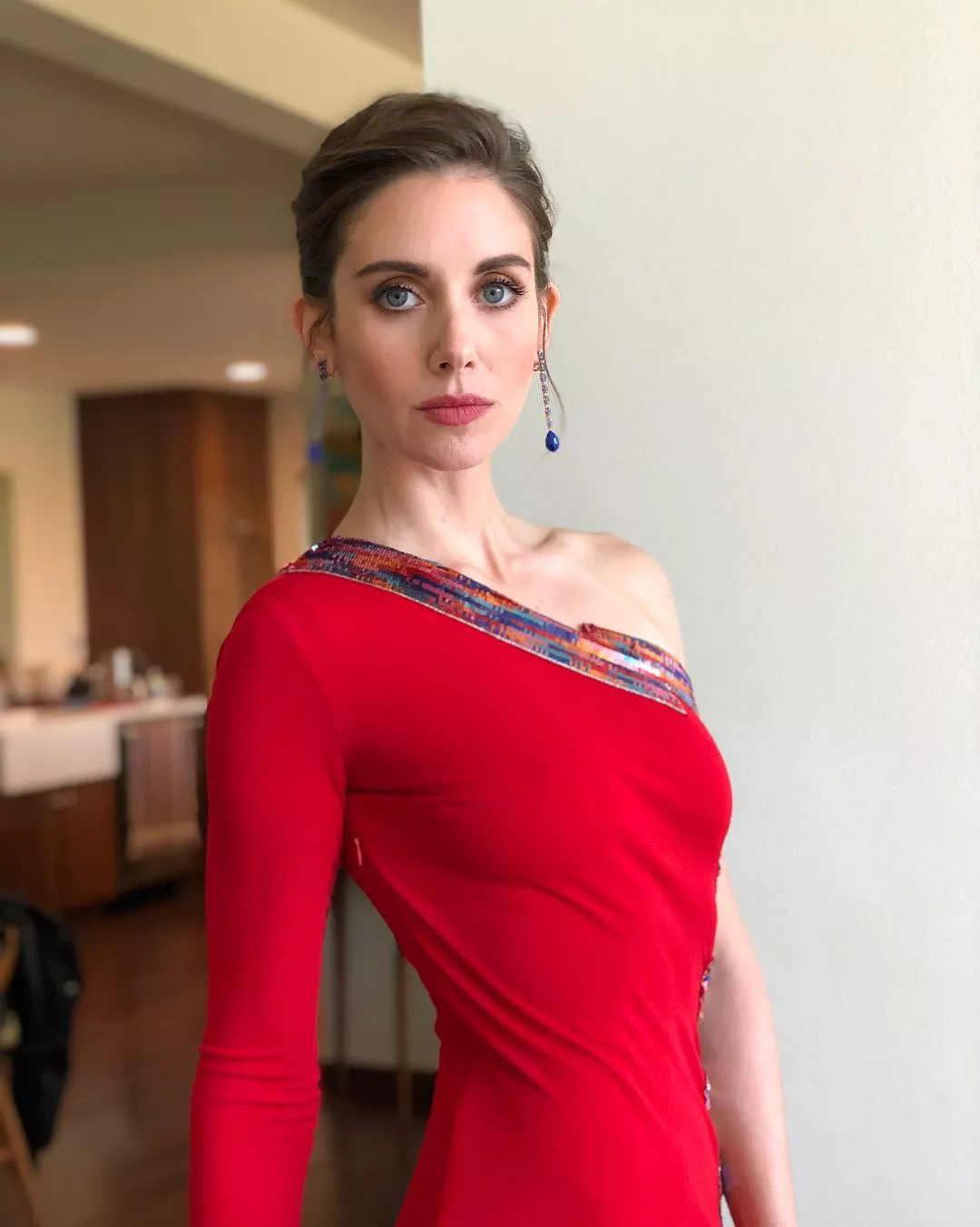 Alison Brie rocking that red dress braless