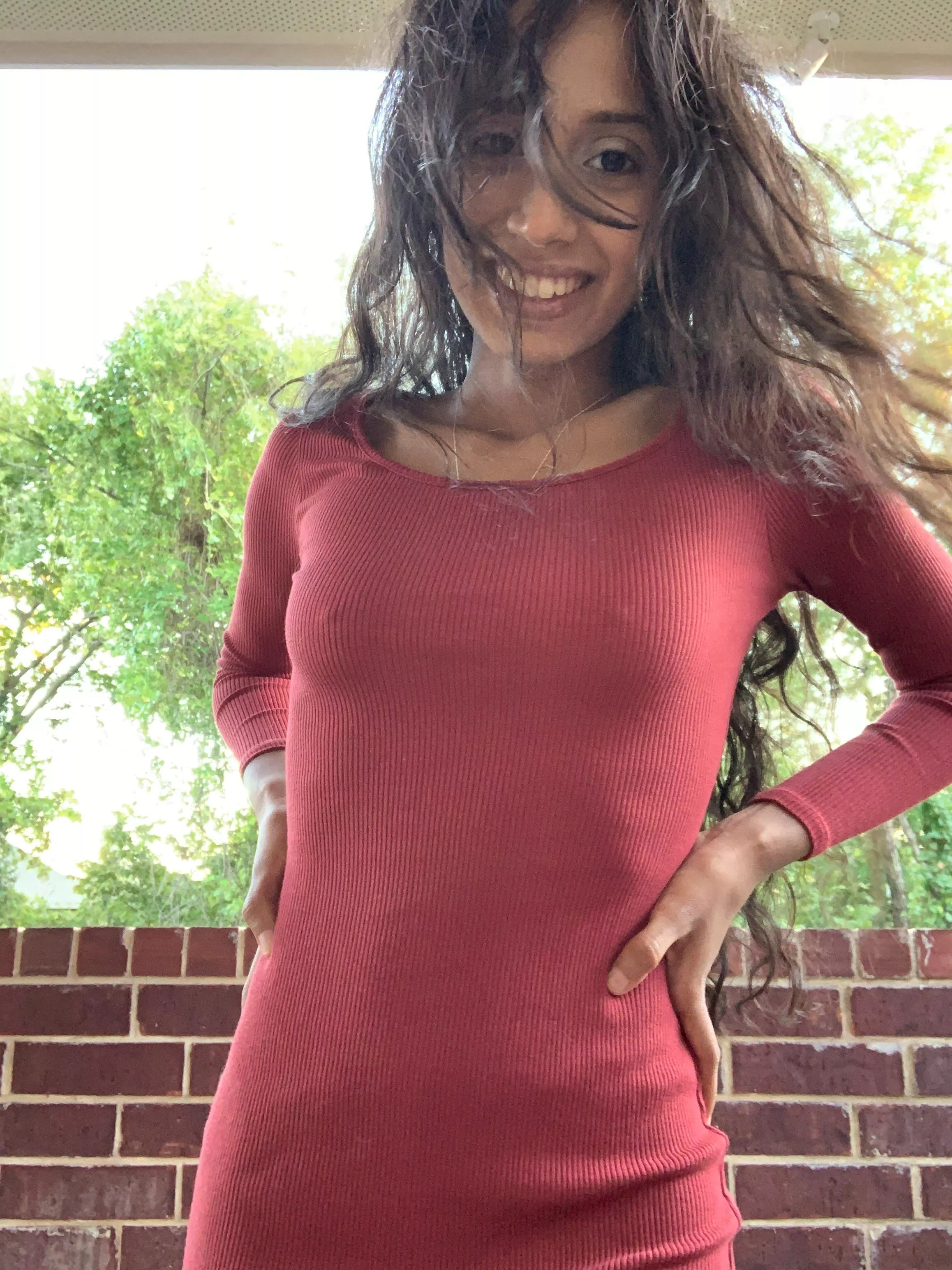 All smiles and no bra!