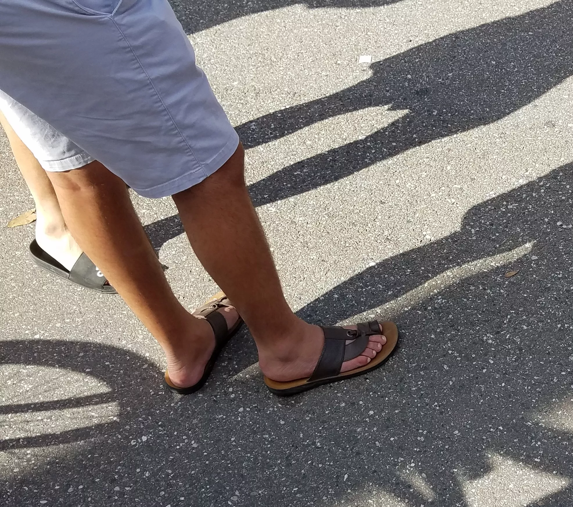 Arabic feet in traditional leather sandals at a festival