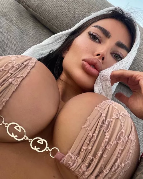 Bikini is squeezing these big tits