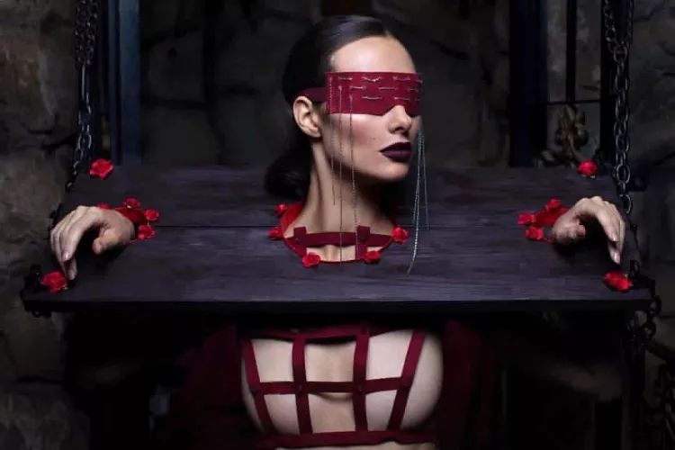 Bound, restrained, blindfolded and waiting.