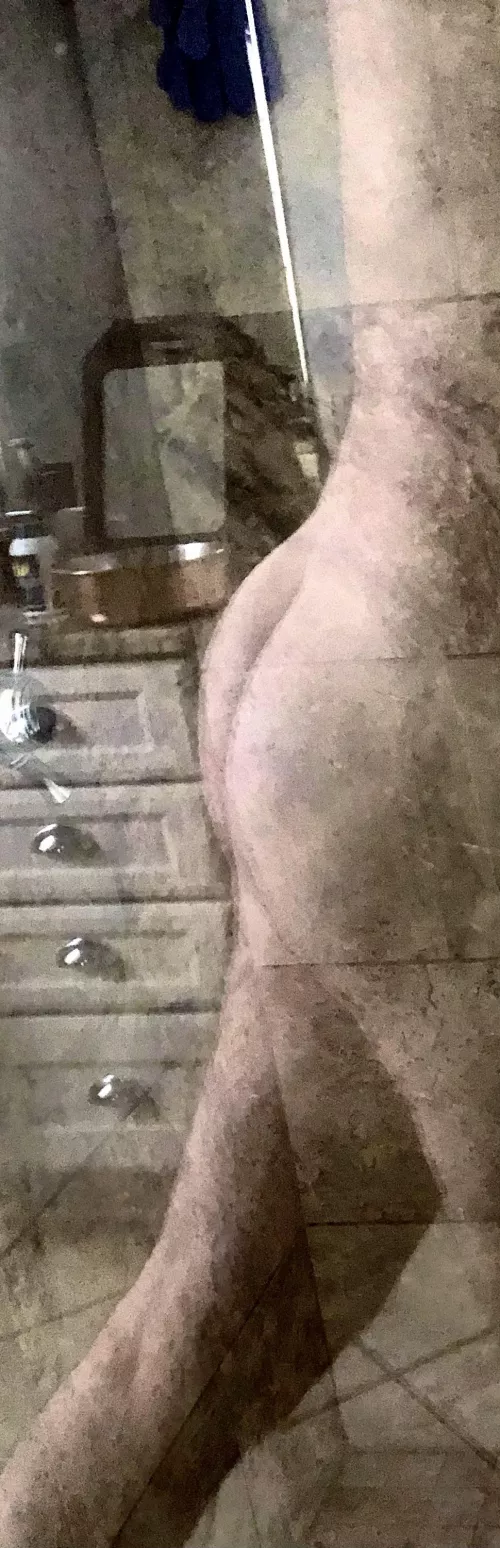Bubble reflecting in the shower glass