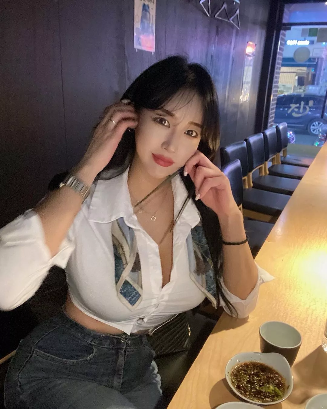 Bursting out of her shirt