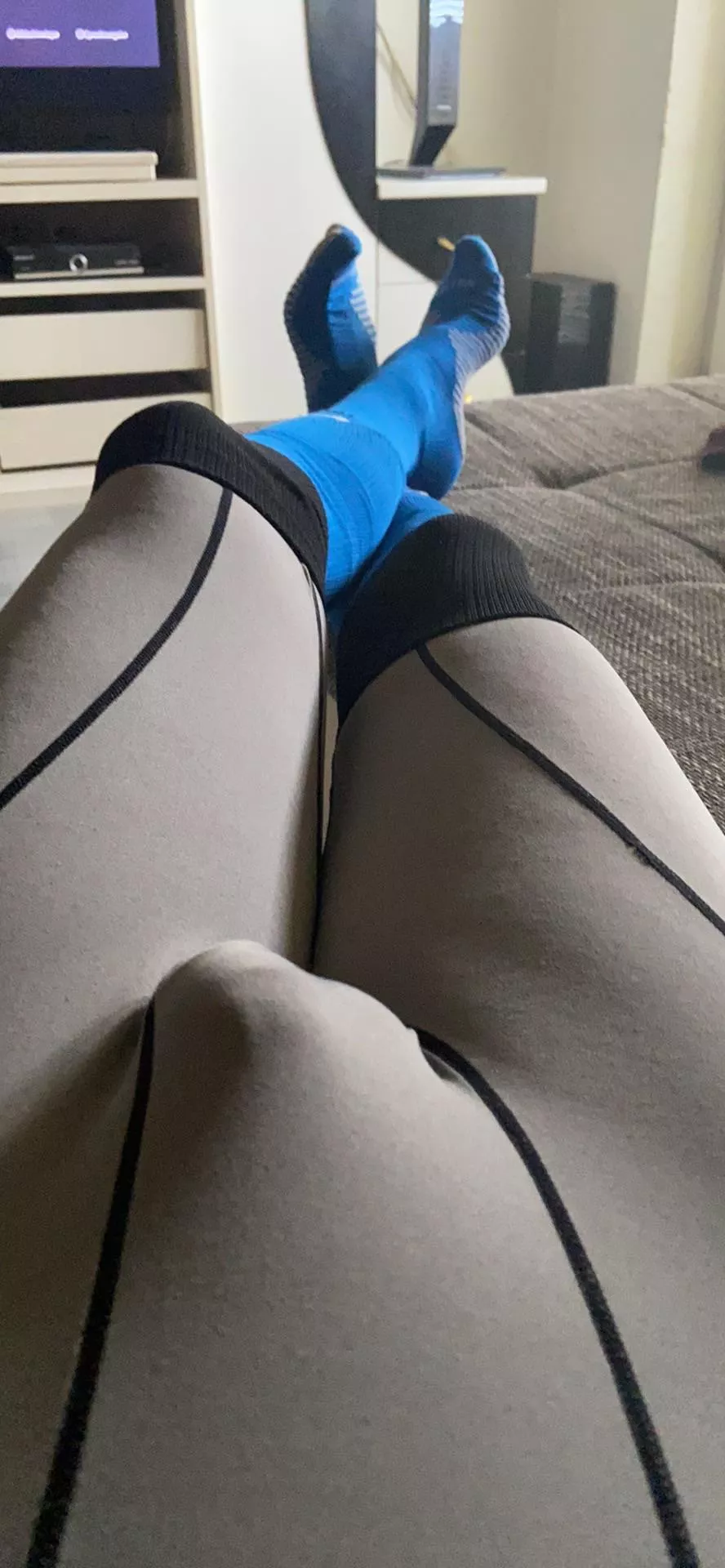 chilling and smoking wearing my grey gym tights and long blue soccer socks 😅