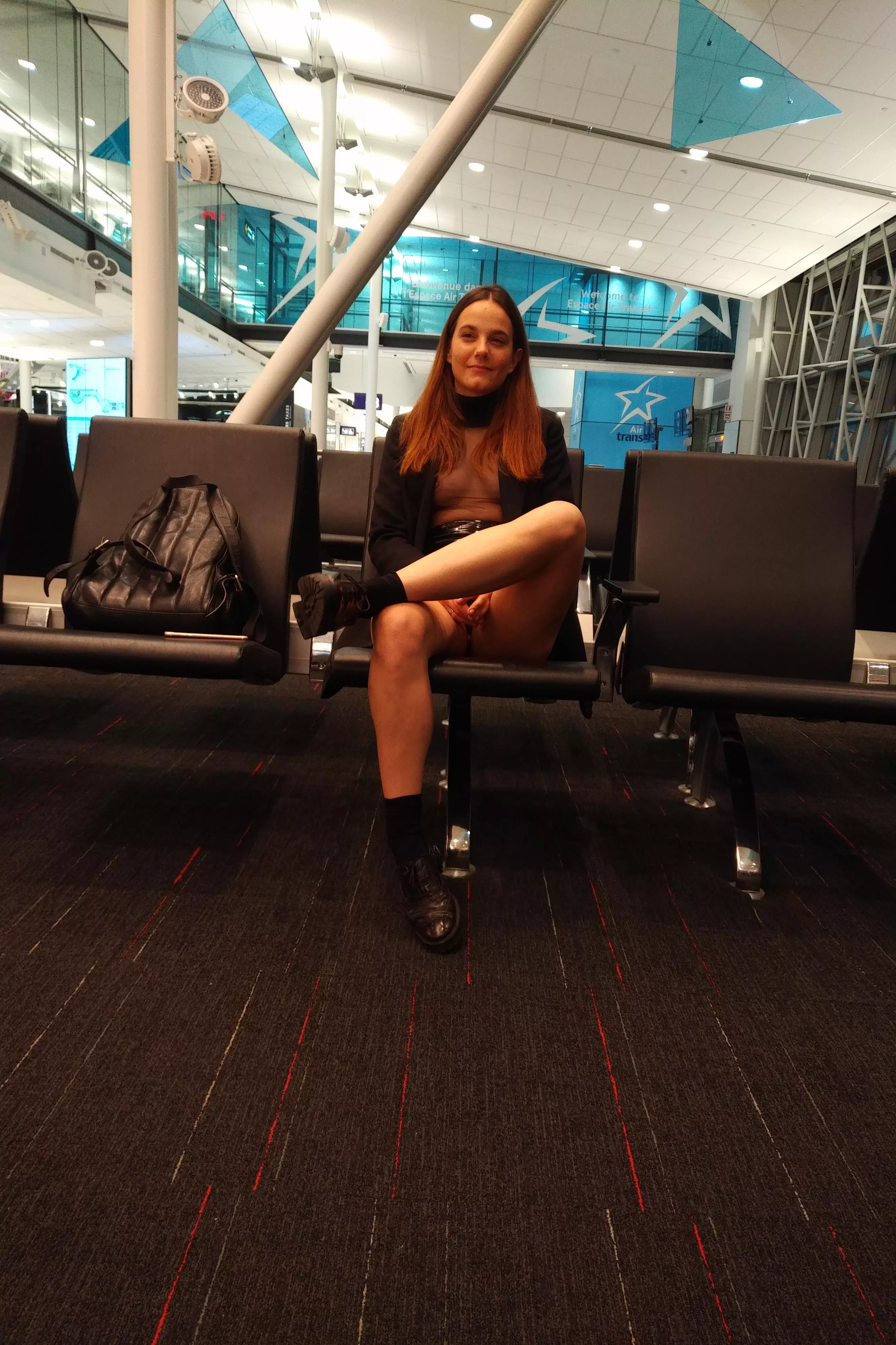 Crossing my legs to give the passengers a better view of my pantiless cunt. Turned me on sooo much seeing their eyes looking in between my legs .