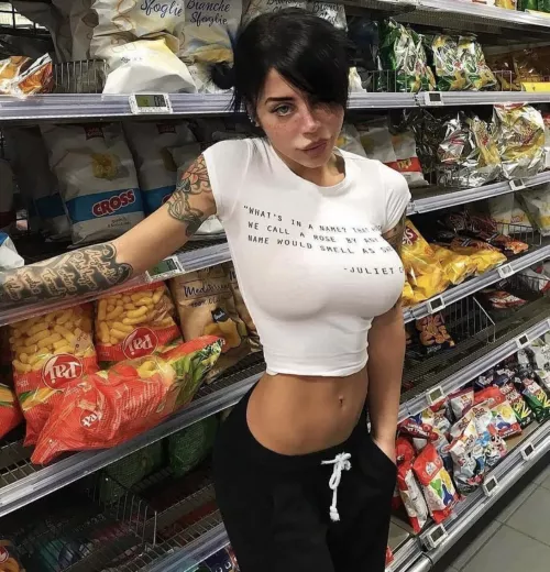 Cute inked busty brunette