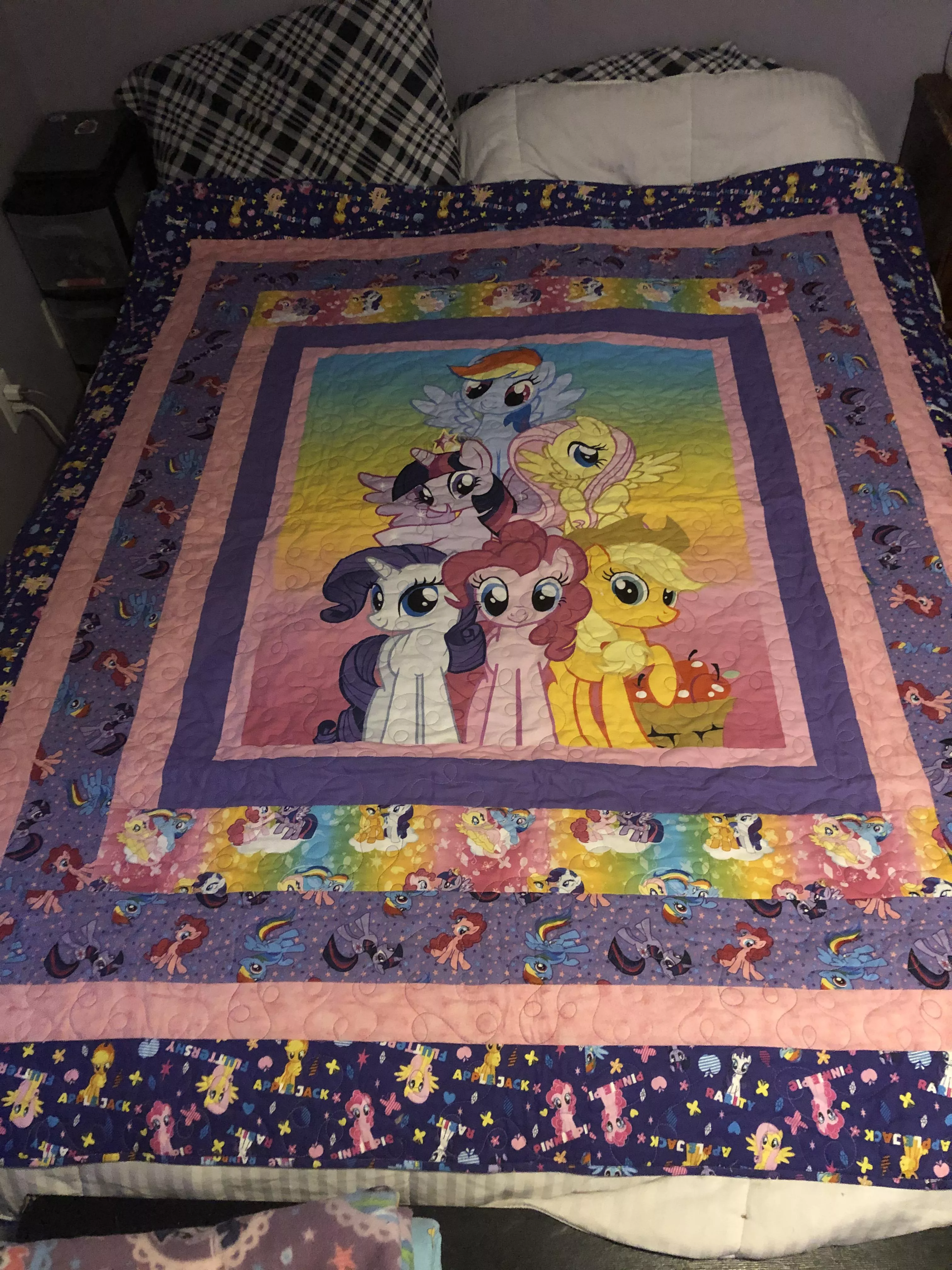 Daddy got me a new quilt and he said we can put it on our bed!