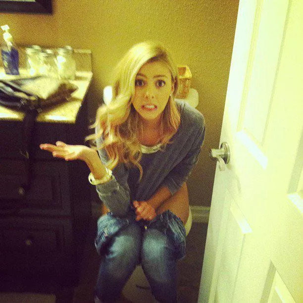embarrassed girl strikes a pose embarrassed girl strikes a pose