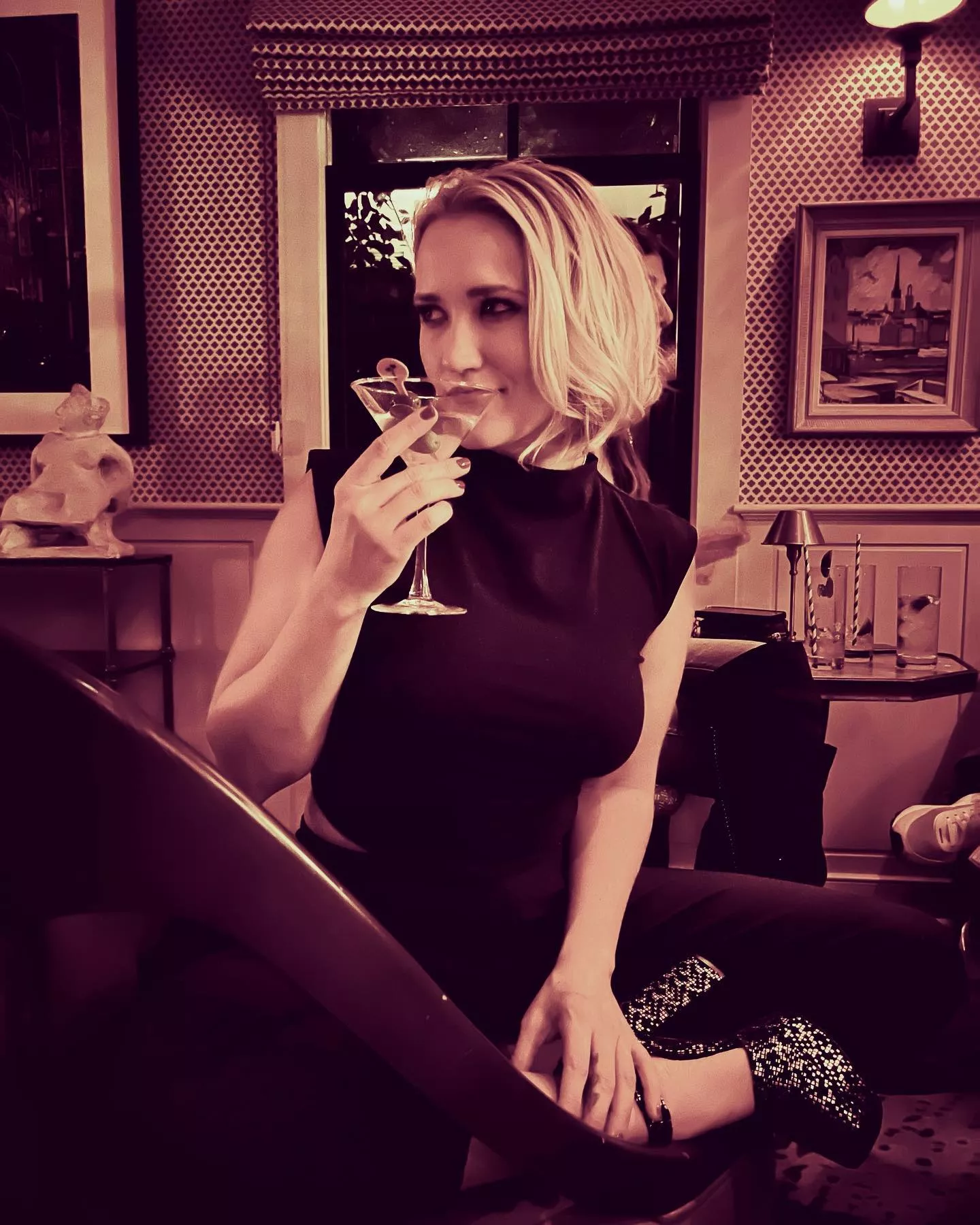 Emily Osment having a cocktail