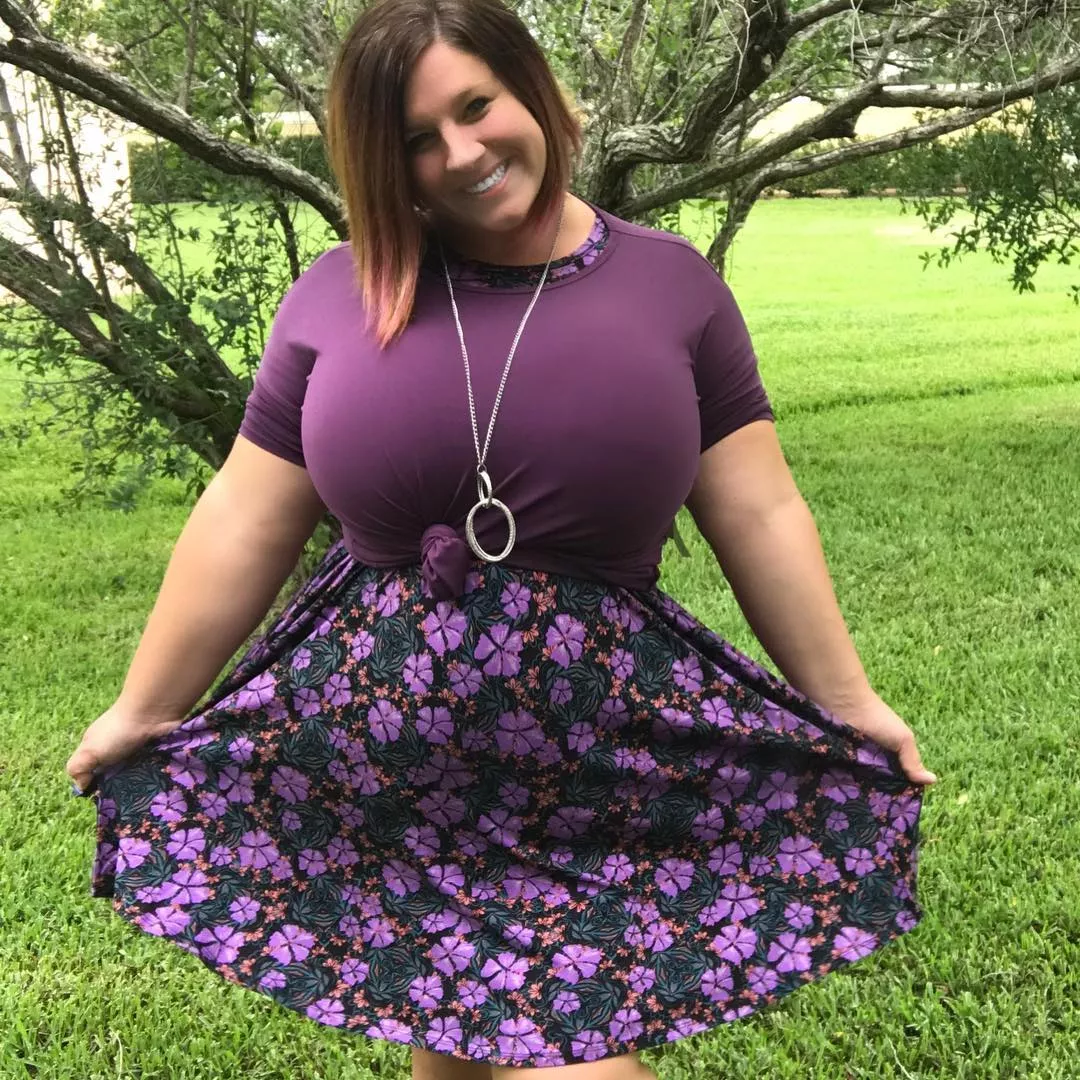 Filling up her purple tee