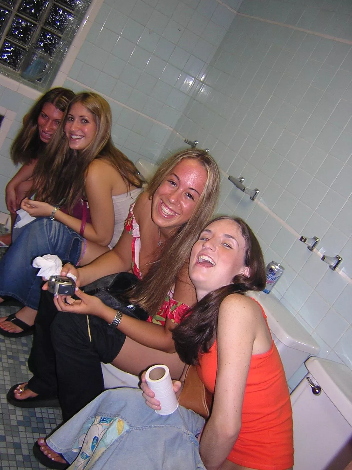 Four toilets, no stalls Four toilets, no stalls