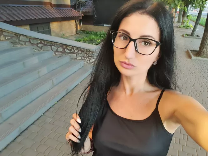 Girl with glasses in the streets of Ukraine π