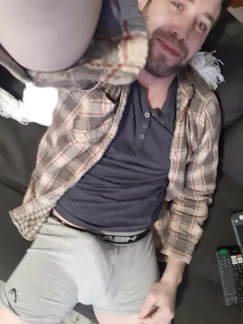Grey boxers and plaid shirt on the couch