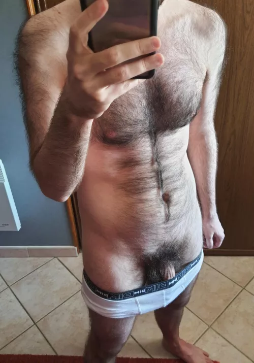 Hairy chest, pubes and hints of a veiny dick: