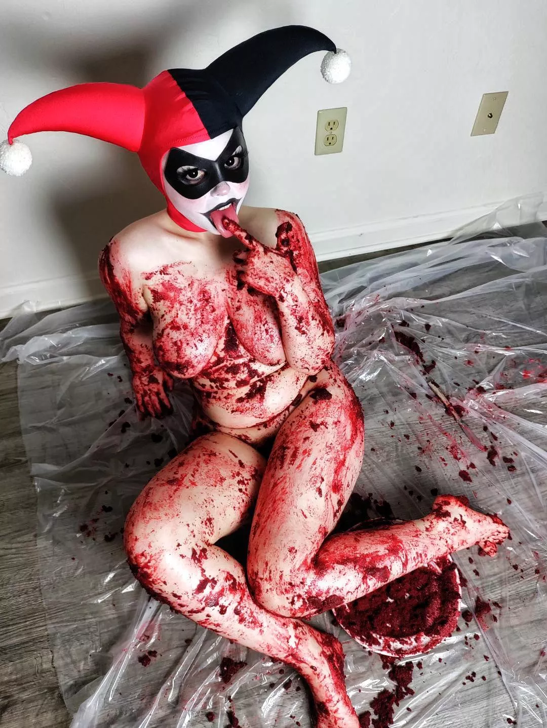 Harley Quinn got a little messy sitting on red velvet cake!