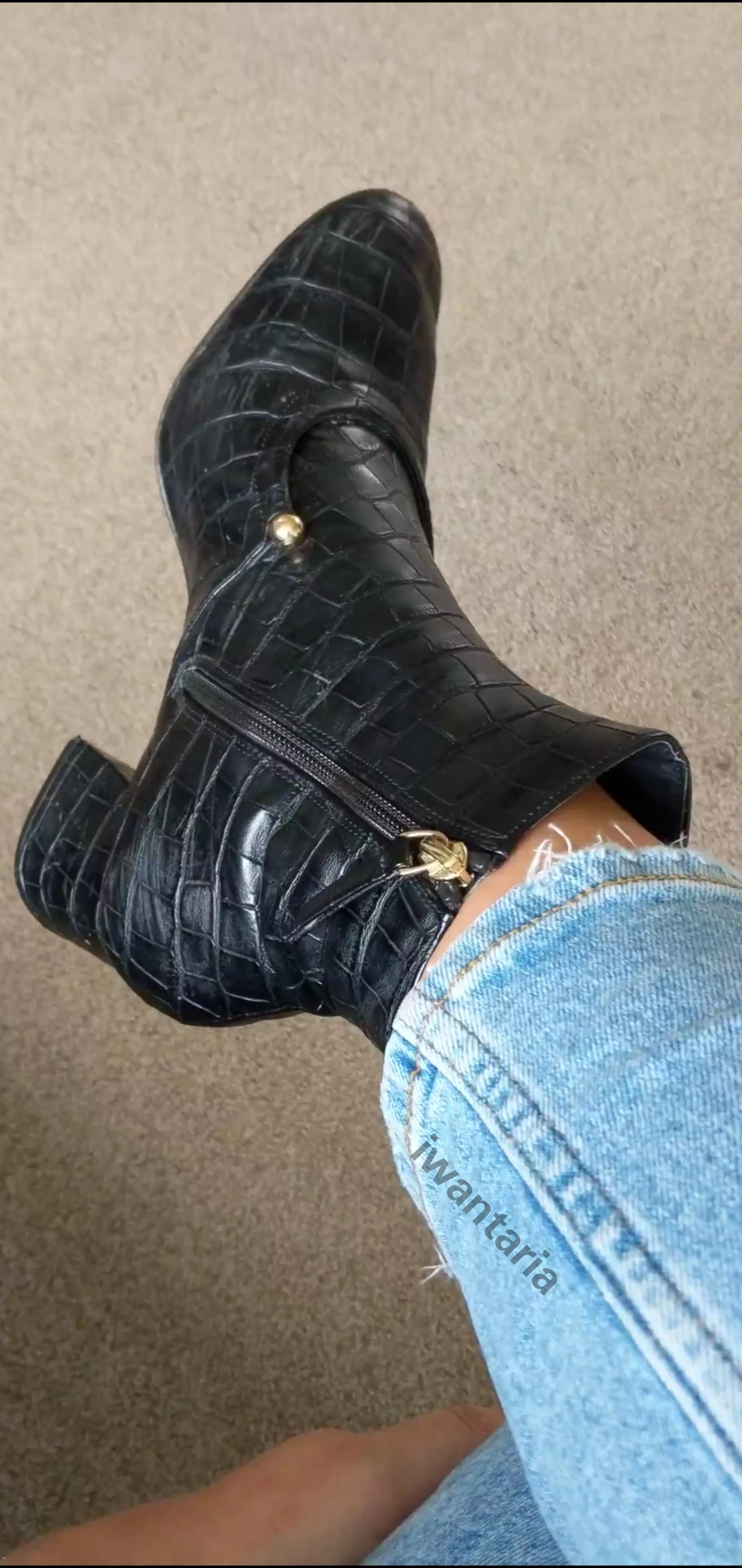 Heeled boots and jeans . Heeled boots and jeans .