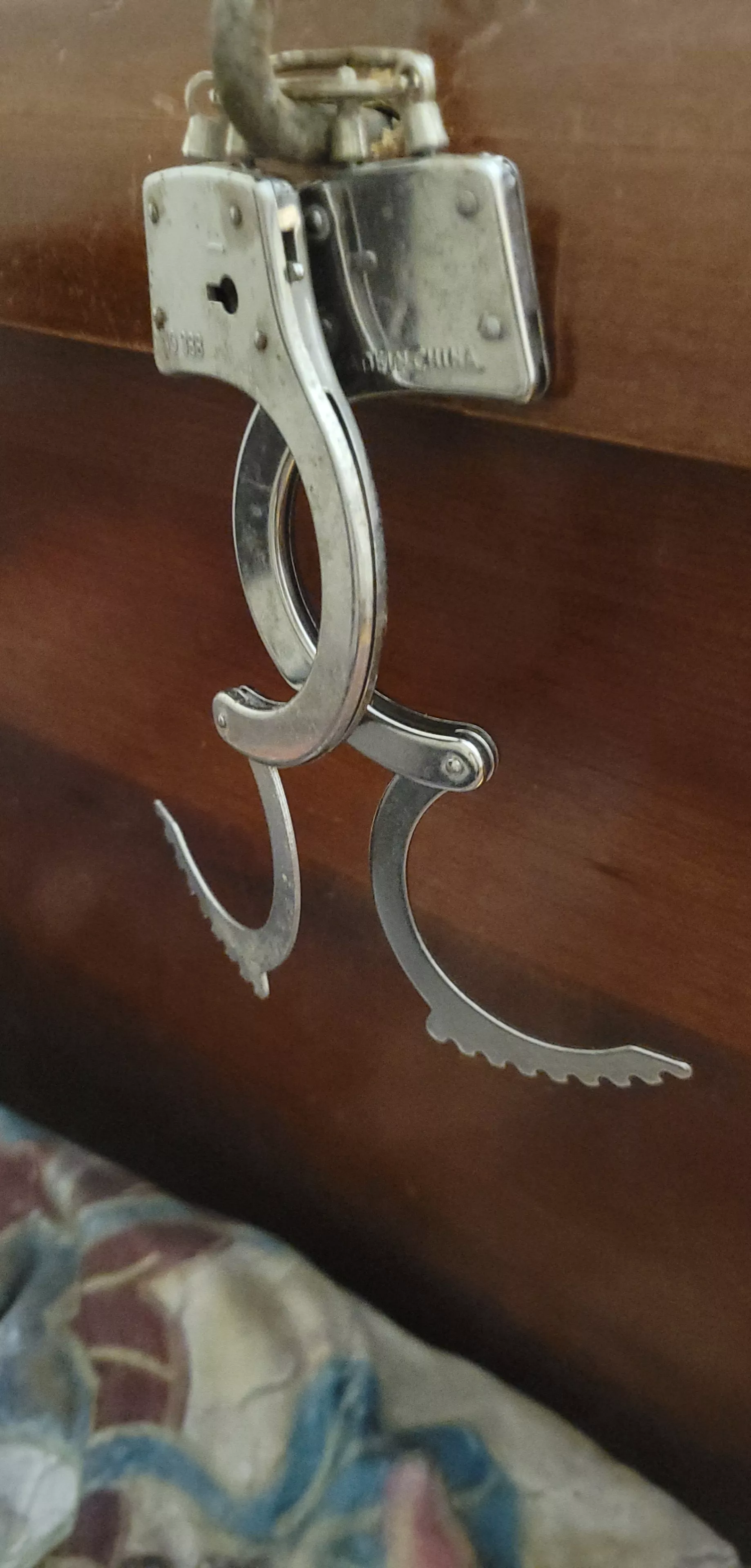 Hook screw plus handcuffs plus headboard ?