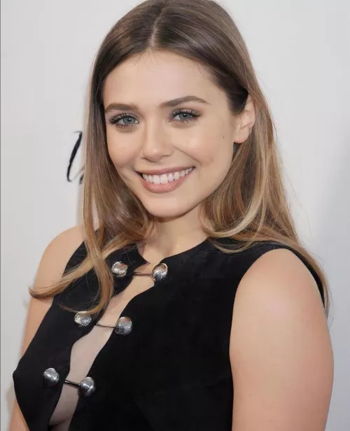 Jerking to Elizabeth Olsen erotic smile while she exposes her cleavage feels so good Jerking to Elizabeth Olsen erotic smile while she exposes her cleavage feels so good