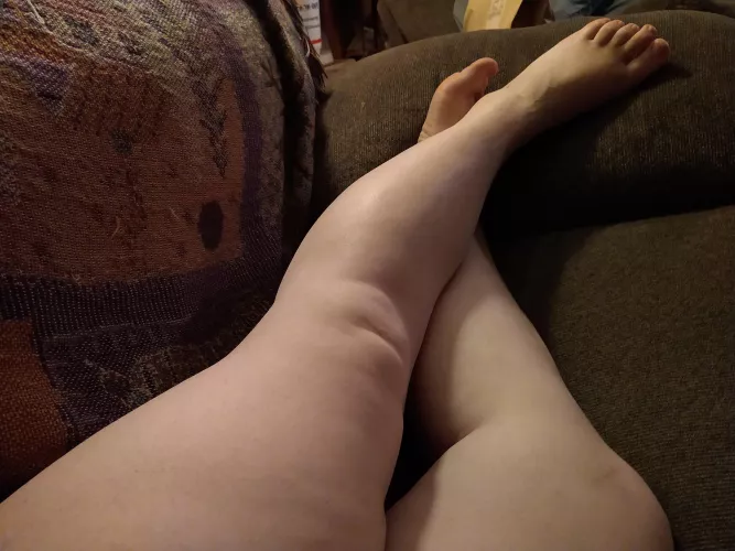 Laying on the couch. ð