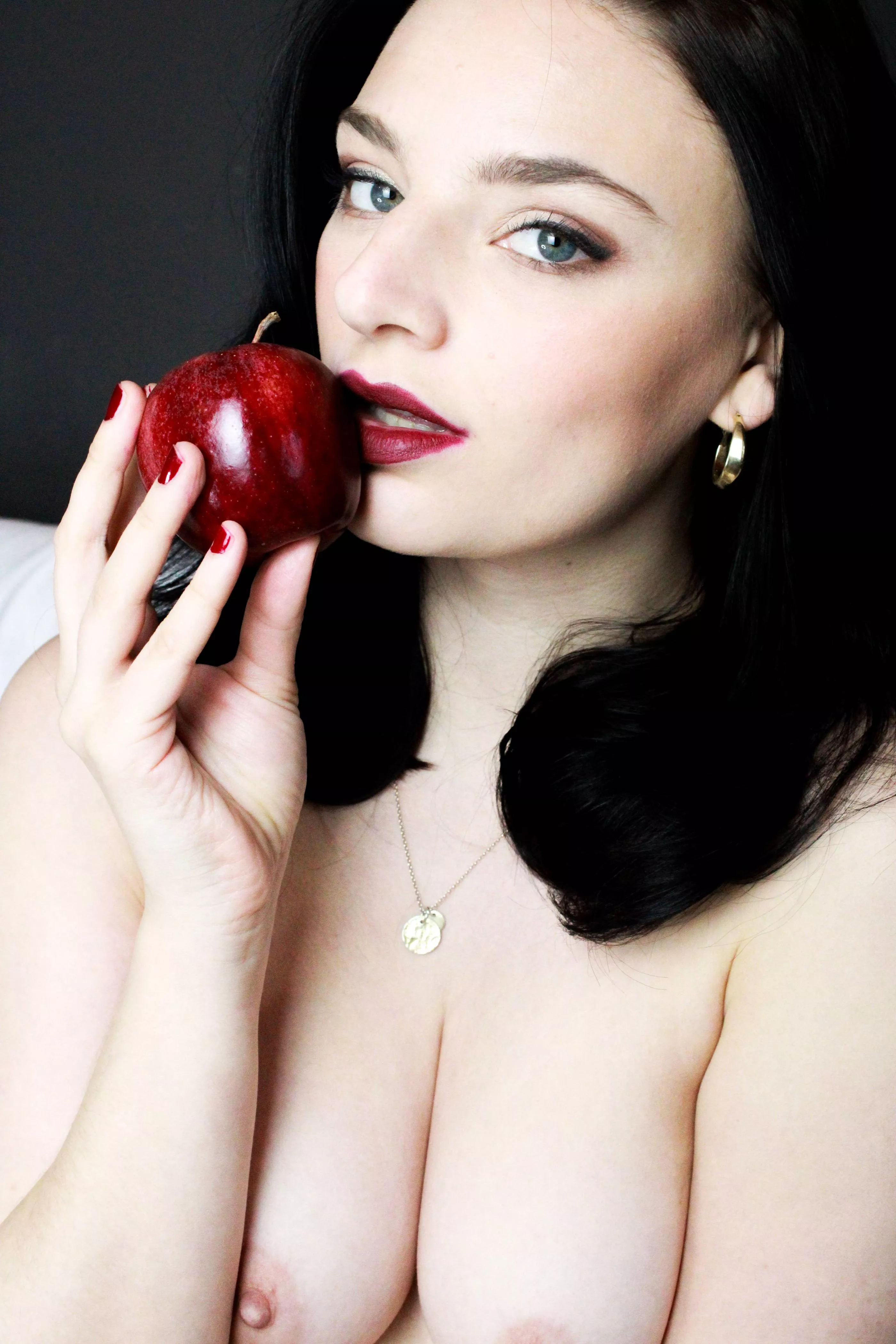 Lips red as the rose hair black as ebony skin white as snow.