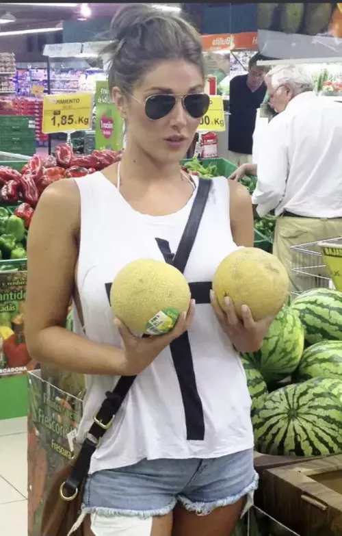 Lucy holding her melons Lucy holding her melons