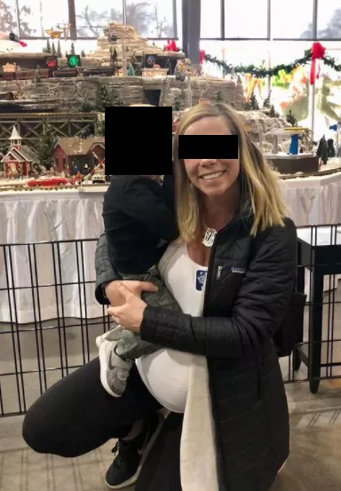 Me holding my second youngest while 9 months pregnant. Hubby spent about $500 on us that day while baby daddy relaxed at home lol!