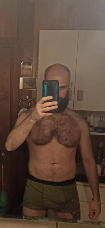 Modestly hiding behind a phone Modestly hiding behind a phone