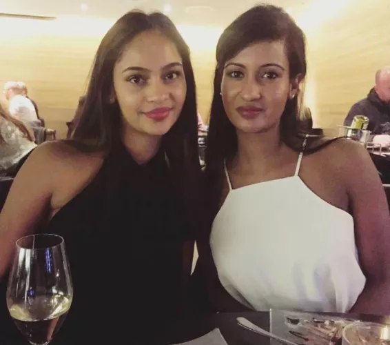 Mother right and left daughter.