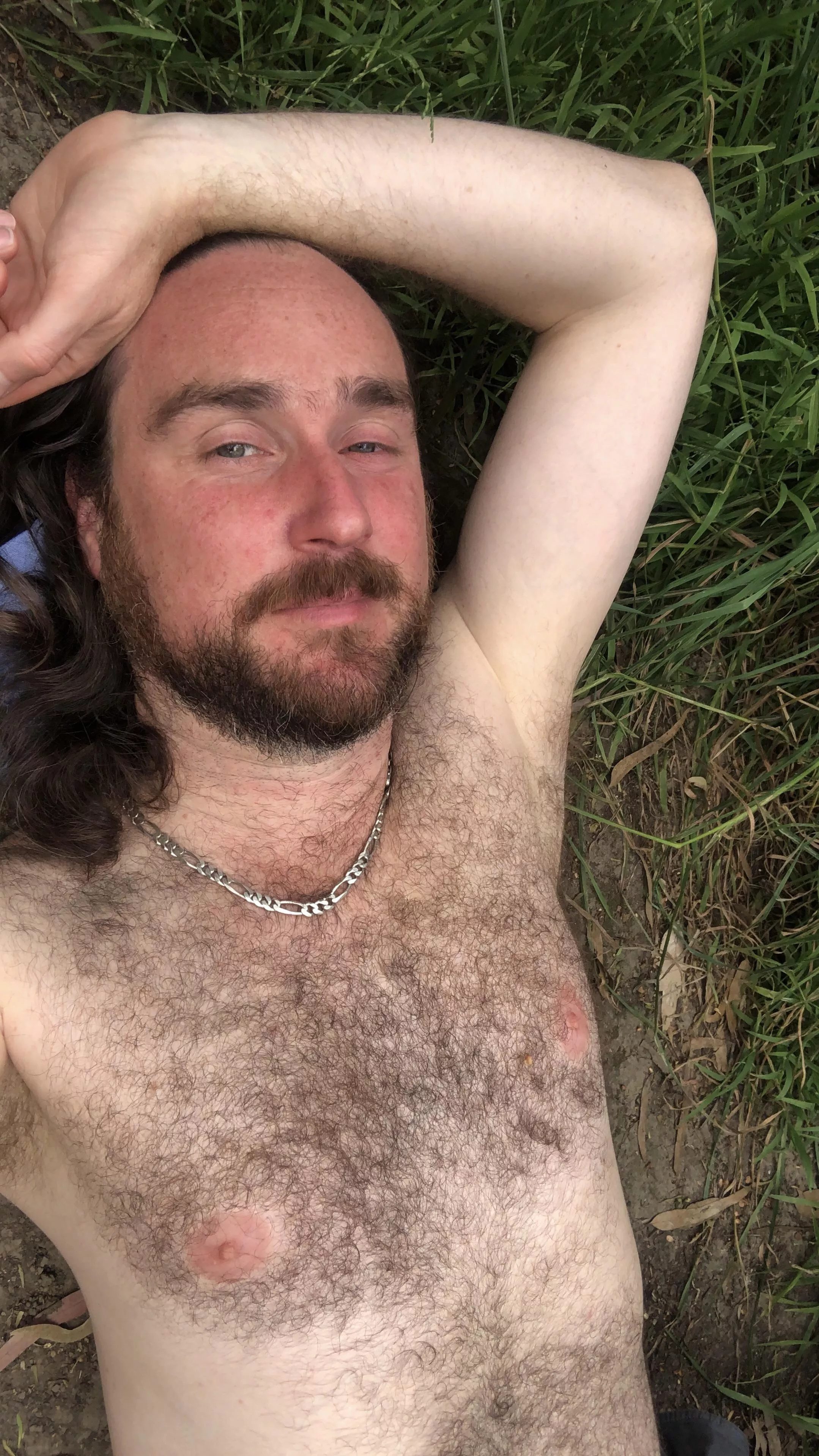 Naked in the park, covered in cum