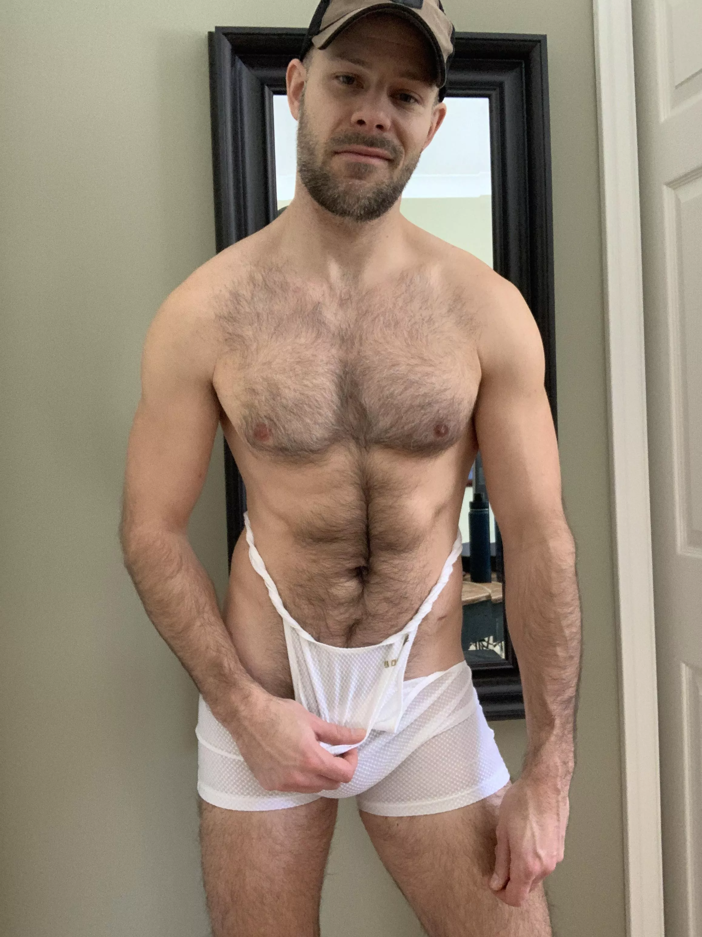 Pulling off my sweaty singlet. Pulling off my sweaty singlet.