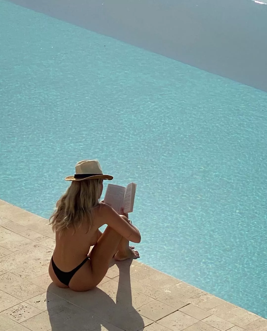 Reading by the pool Reading by the pool