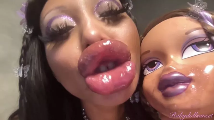 Ruby next to a Bratz doll