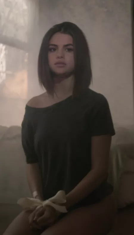 Selena Gomez on her knees with her hands tied Selena Gomez on her knees with her hands tied
