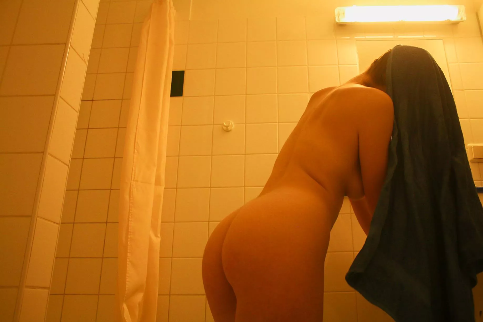 self portrait in my hotel bathroom in berlin 🧡