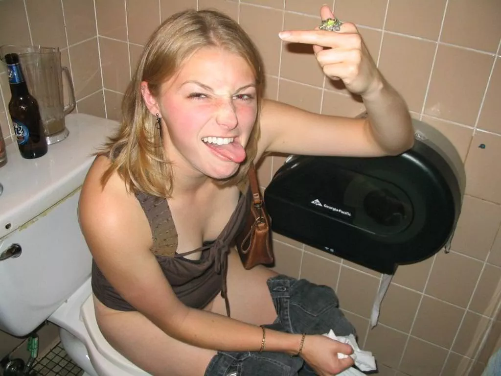 She shouldn't leave her beer on the tank top like that. She shouldn't leave her beer on the tank top like that.
