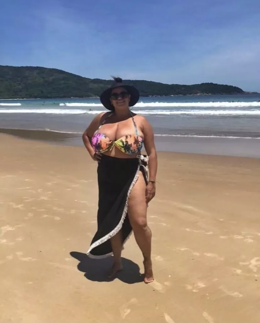 She's really filling up that bikini top