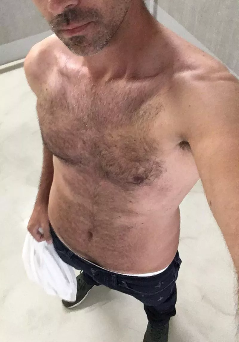 Shirt off in the parking garage Shirt off in the parking garage