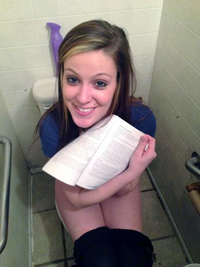 Showing us her reading material Showing us her reading material