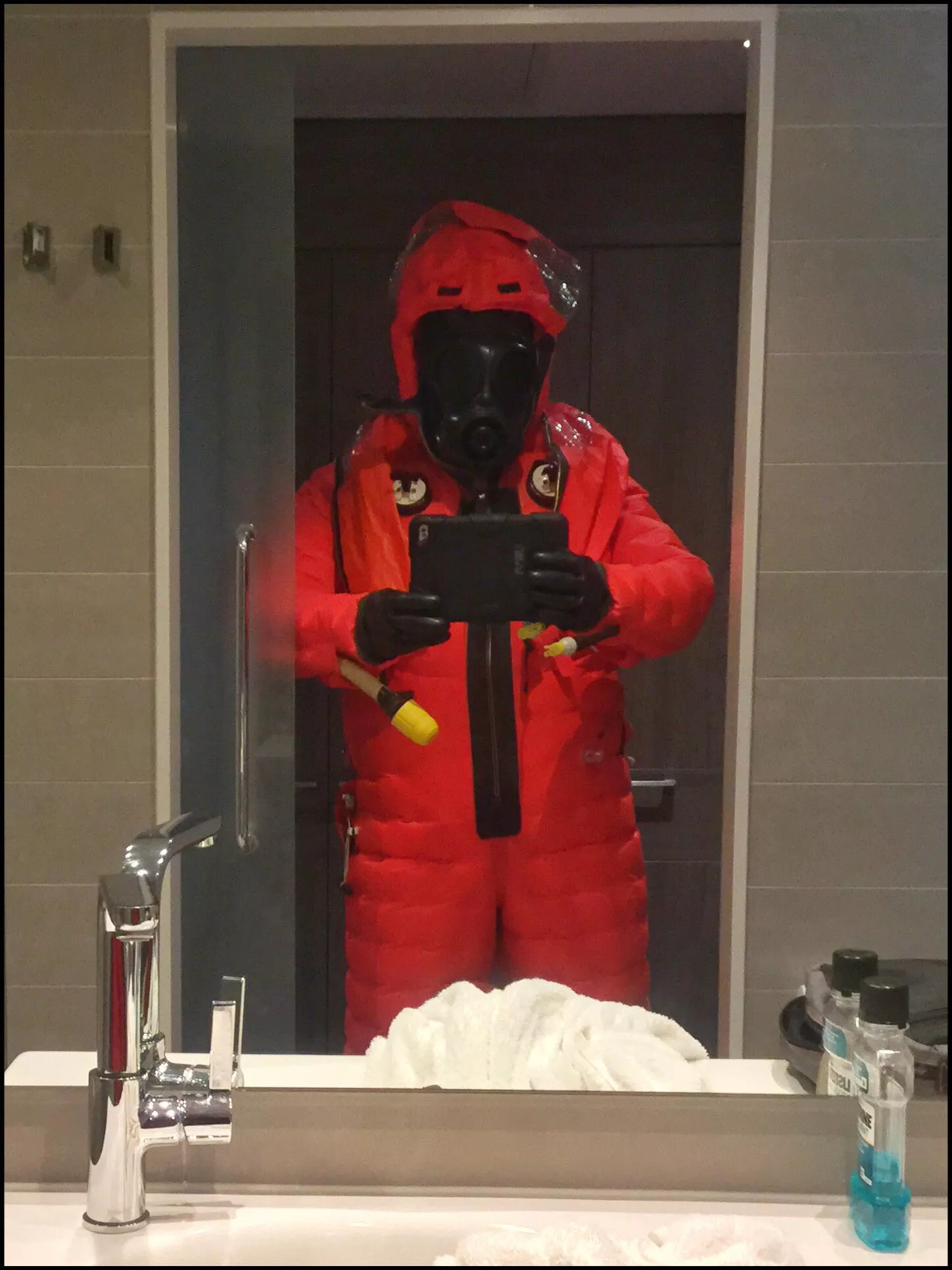 Shuffling around in a very restrictive Submarine Escape Suit…..