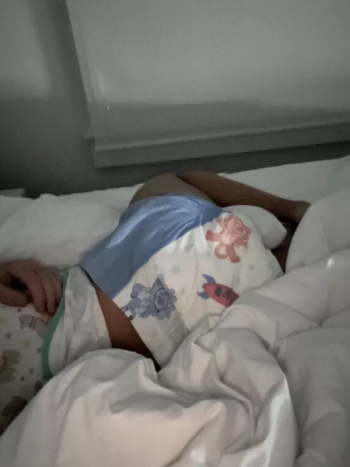 Sleepy baby in a crinkly diaper