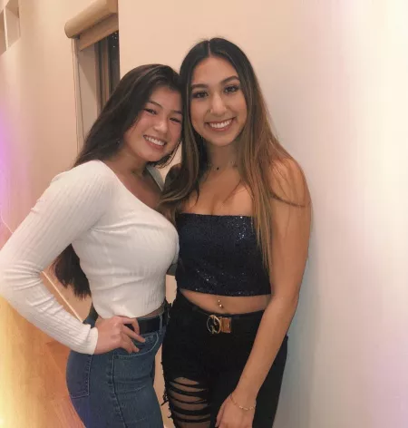 Smiling to pretend that she doesnβt care about her friends chest