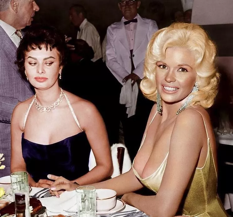 Sophia Loren gives Jayne Mansfield the side-eye. 👀 The photo, taken at a Paramount Pictures party to welcome Loren to Hollywood in 1957, was later colorized. Sophia Loren gives Jayne Mansfield the side-eye. 👀 The photo, taken at a Paramount Pictures party to welcome Loren to Hollywood in 1957, was later colorized.