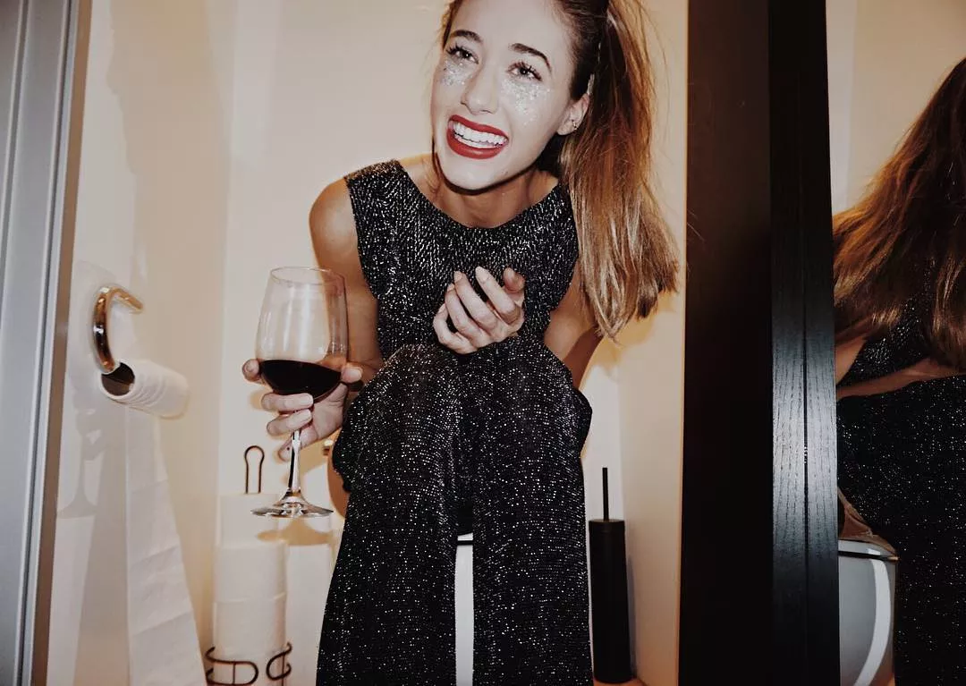Still enjoying her wine. Still enjoying her wine.