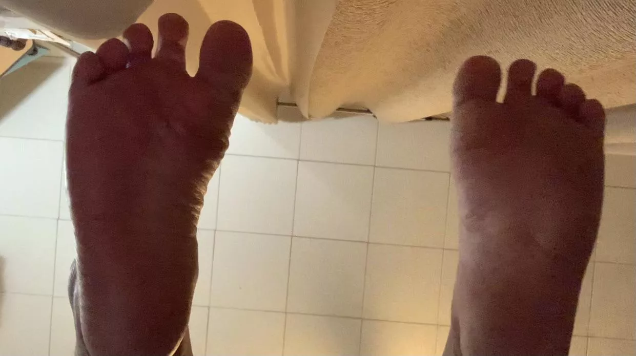 Suck on my toes as you start gliding your tongue down my soles