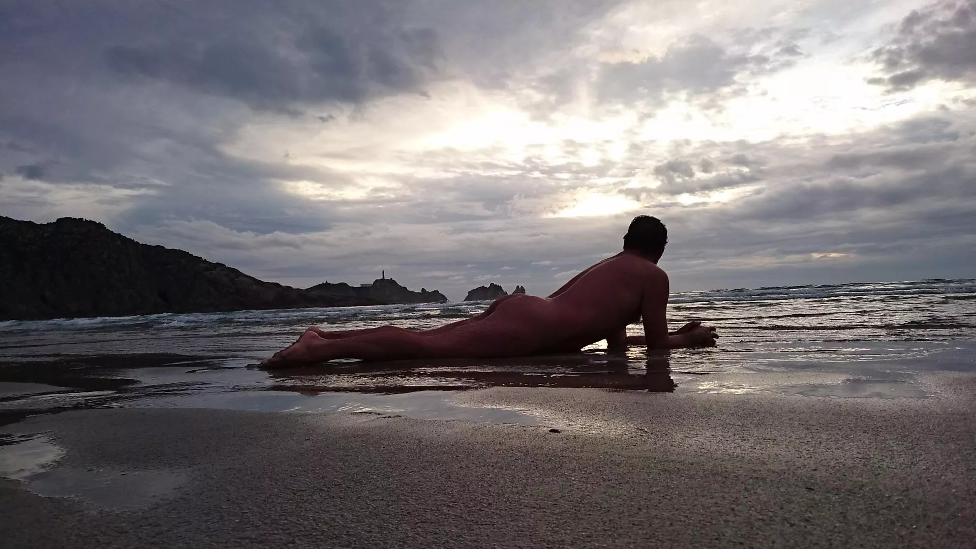 Sunset hunter. Cloudy day at the beach. Nude freedom Sunset hunter. Cloudy day at the beach. Nude freedom