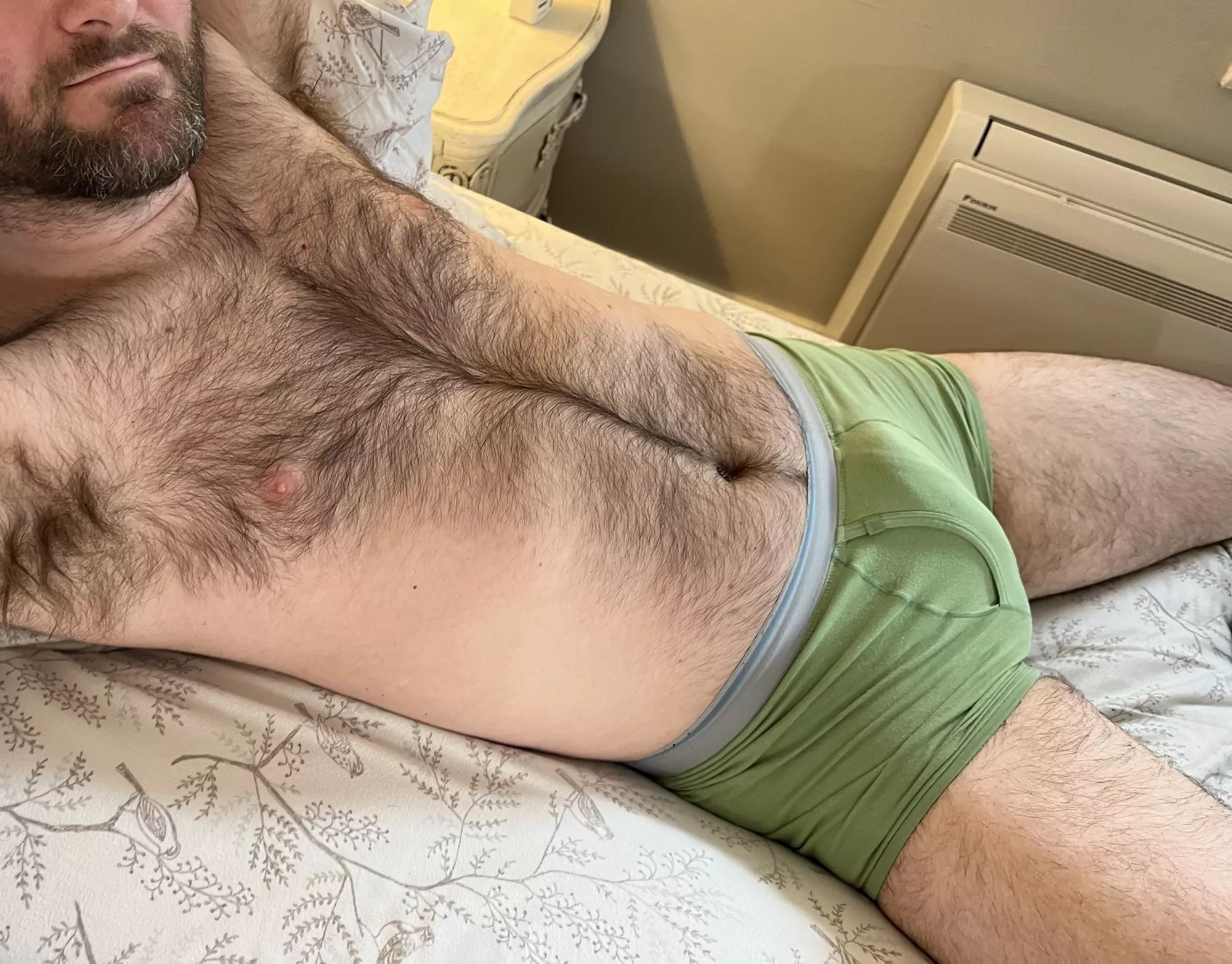 Taking a break from making the bed